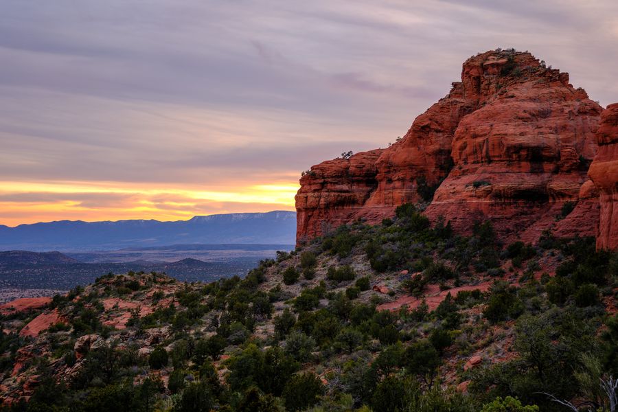 The cliff catches the last light